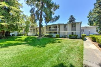 Apartment exterior with large grass area